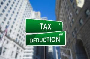 sign post written tax and deduction 